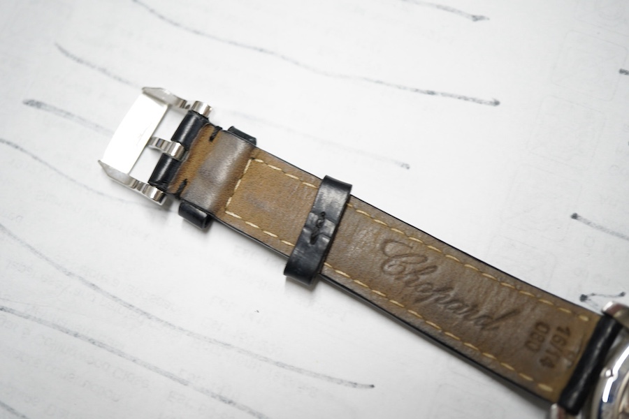 A gentleman's recent 18k white metal L.U. Chopard automatic chronometer wrist watch, with mother of pearl dial, diamond dot markers and subsidiary seconds, the bezel set with small brilliants, case diameter 35mm, movemen